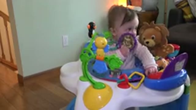 WESTMINSTER COLORADO-2015: Toddler Wearing an Onset in a Play Chair Holding Toys