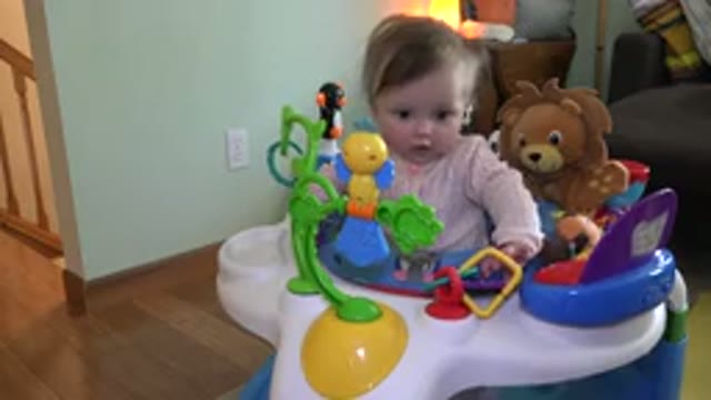 WESTMINSTER COLORADO-2015: Curious Baby Standing Inside Play Table Full of Toys