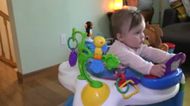 WESTMINSTER COLORADO-2015: Baby Girl Playing With Bright And Colorful Toys