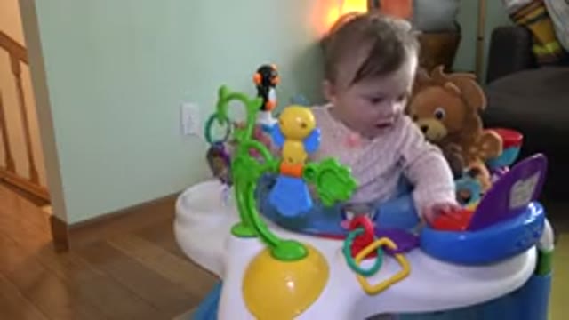 WESTMINSTER COLORADO-2015: Small Toddler Playing in Her Chair with a Lot of Toys
