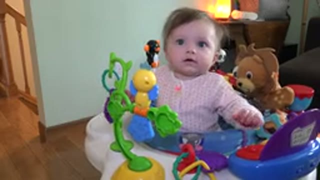 WESTMINSTER COLORADO-2015: Cute Little Toddler Sitting On A Colorful Bouncer