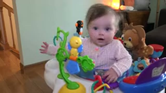 WESTMINSTER COLORADO-2015: A Cheerful Baby Enjoys In Her Walker Equipped With Toys