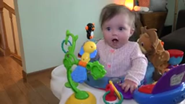 WESTMINSTER COLORADO-2015: A Happy Baby Sitting In Their Saucer Surrounded By Toys