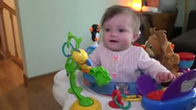 WESTMINSTER COLORADO-2015: Small Toddler Wearing a Pink Shirt Playing with Toys