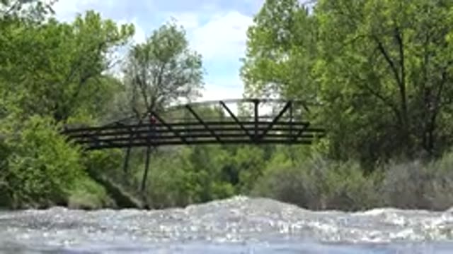 WESTMINSTER COLORADO-2015: Scenic View Of Rushing Water And Bridge With Person