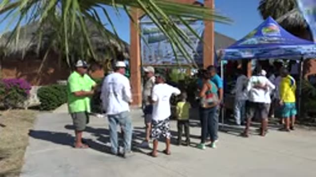 PLAYITA BCS MEXICO-2017: People Standing Near A Booth In A Park Chatting Or Waiting