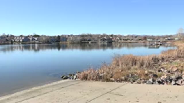 HIDDEN LAKE COLORADO-2017: View Of A Peaceful Lake With A Road In The Background