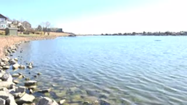 HIDDEN LAKE COLORADO-2017: Still Time-Lapse Shot Of Rippling Water Against Rocks