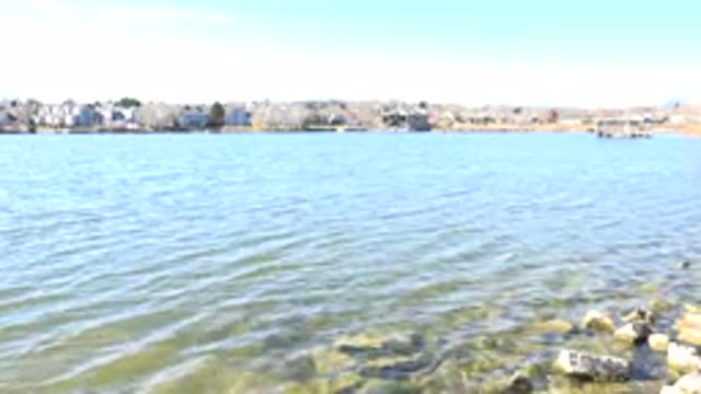 HIDDEN LAKE COLORADO-2017: View Of A Water Coast With Nature And Buildings