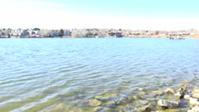 HIDDEN LAKE COLORADO-2017: A View Looking Across The Rocky Shore Of A Bay
