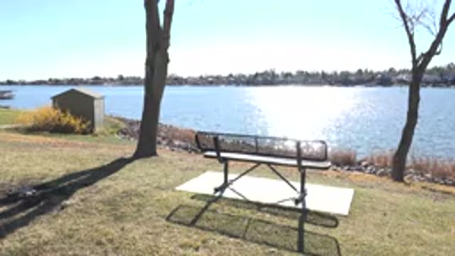 HIDDEN LAKE COLORADO-2017: Bench To Sit In The Middle Of A Park In Front Of A Lake