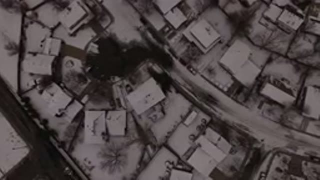JEFFERSON COUNTY COLORADO-2015: Aerial View Of A City In Winter With Snow And A Car Passing