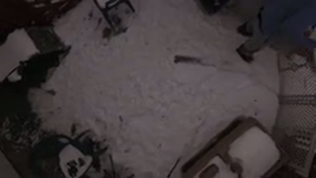 JEFFERSON COUNTY COLORADO-2015: Dark Drone View Of A Man In His Snowy Backyard
