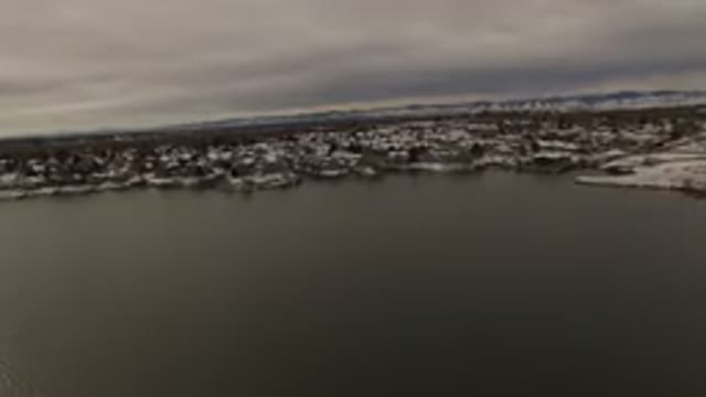 JEFFERSON COUNTY COLORADO-2015: Helicopter View Of A Lakeside City With A Mountain Backdrop