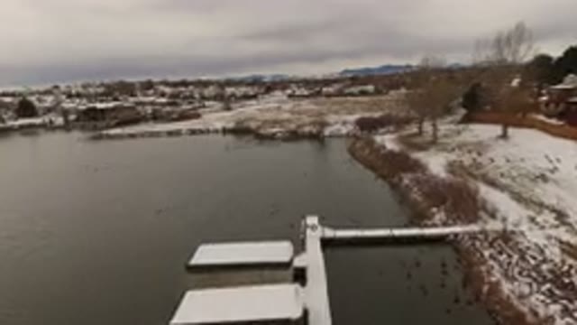 JEFFERSON COUNTY COLORADO-2015: Aerial Footage Of A Lake In Winter Time With Snow-Covered Docks