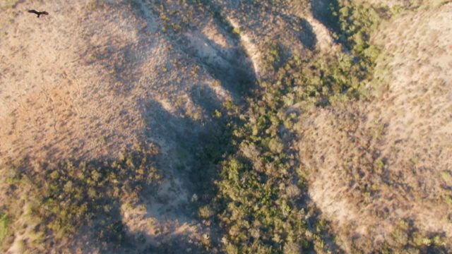 CABO PULMO BCS MEXICO-2023: Rugged Mountain Terrain with Distant Ocean View