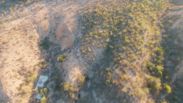 CABO PULMO BCS MEXICO-2023: Hillside with Scattered Buildings and Sparse Vegetation