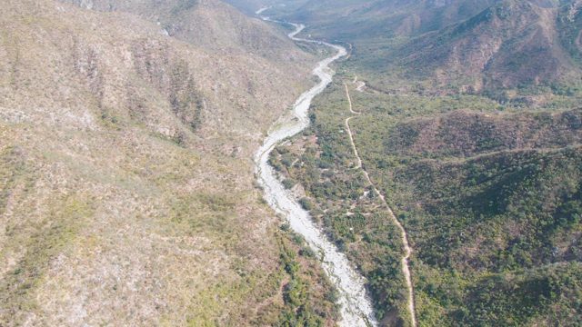 SAN DIONISIO BCS MEXICO-2023: Winding River and Road Through Mountain Valley