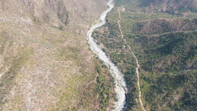SAN DIONISIO BCS MEXICO-2023: Winding River Flowing Through Mountain Valley