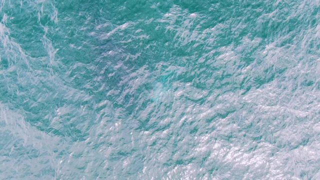 SHIPWRECKS EAST CAPE BCS MEXICO-2023: Ocean Surface with Shifting White Foam and Turquoise Water