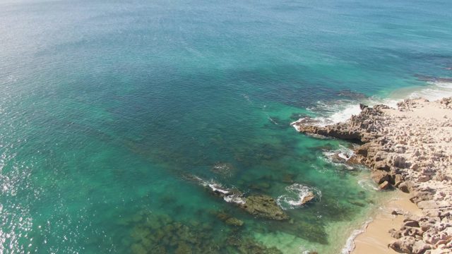 BUZZARDS BEACH EAST CAPE BCS MEXICO-2023: Waves Crashing on Rocky Coast Aerial