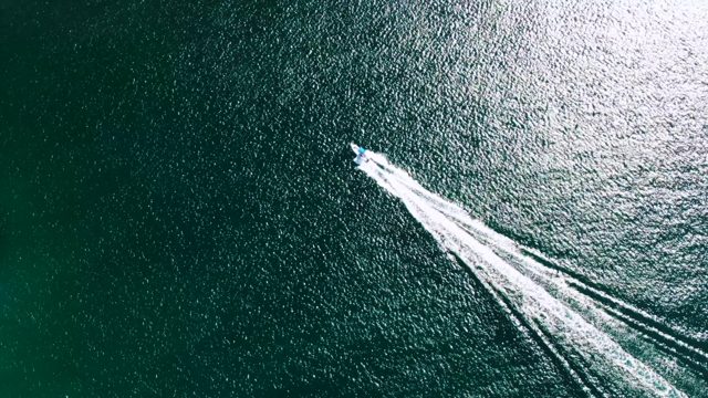 BUZZARDS BEACH EAST CAPE BCS MEXICO-2023: Speedboat Moving Across Calm Ocean Leaving White Wake
