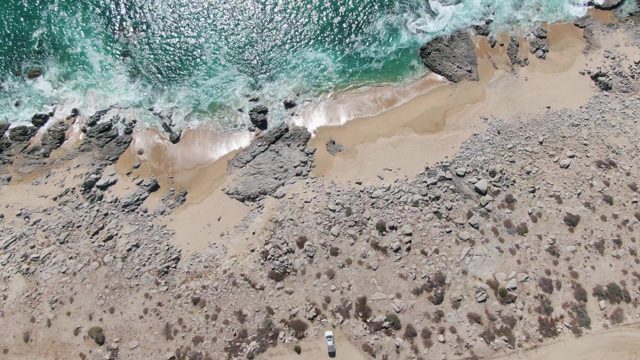 BUZZARDS BEACH EAST CAPE BCS MEXICO-2023: Waves Advancing on Rocky Coastal Shore