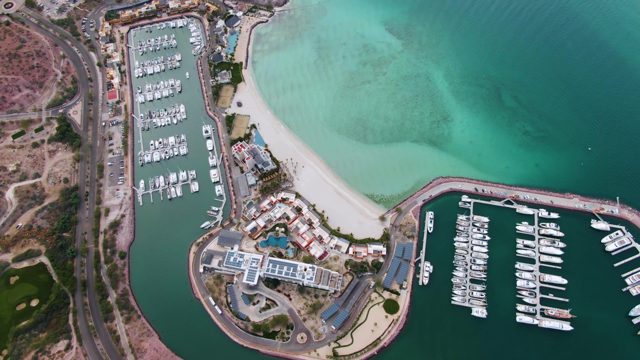 LA PAZ BCS MEXICO-2023: Coastal Marina with Traffic and Sandy Shore