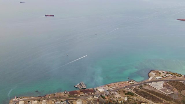 LA PAZ BCS MEXICO-2023: Coastal Industrial Zone with Ocean Vessels and Water Trails