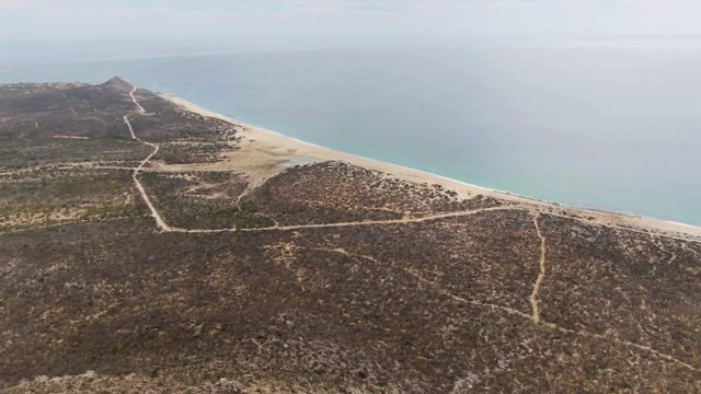 PUNTA GORDA BEACH BCS MEXICO-2023: Gentle Waves Lapping a Sandy Beach and Rocky Coast
