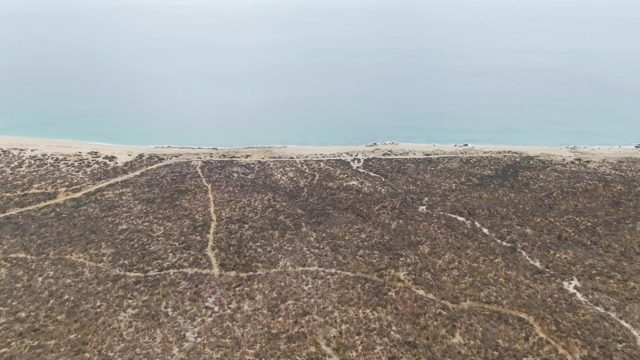 PUNTA GORDA BEACH BCS MEXICO-2023: Coastal Dunes and Beach with Vehicles Moving Along Shore