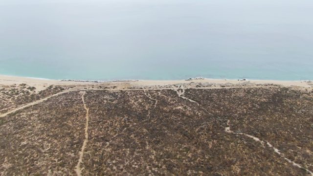 PUNTA GORDA BEACH BCS MEXICO-2023: Vehicle Moving on Sandy Beach Near Ocean Dunes