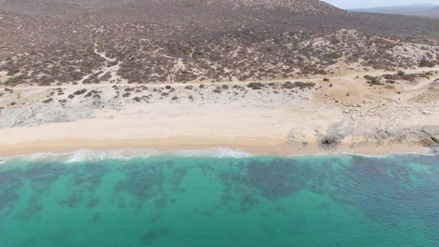 PUNTA GORDA BEACH BCS MEXICO-2023: Gentle Waves Lapping Sandy Shore and Rocky Coast
