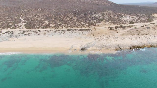 PUNTA GORDA BEACH BCS MEXICO-2023: Waves Breaking on Sandy Beach Coastline