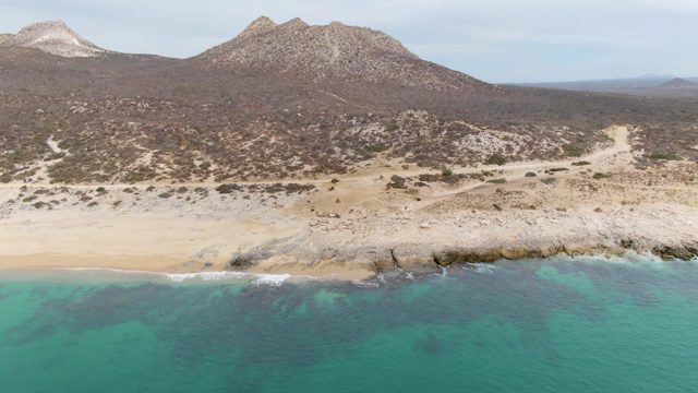 PUNTA GORDA BEACH BCS MEXICO-2023: Gentle Ocean Waves on Rocky Coastal Beach