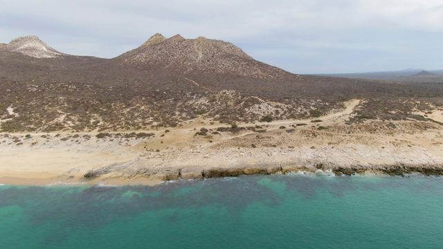 PUNTA GORDA BEACH BCS MEXICO-2023: Mountain-Backed Beach with Calm Ocean Waves