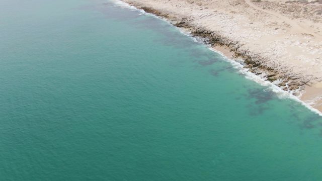 PUNTA GORDA BEACH BCS MEXICO-2023: Coastal Shoreline Transitioning From Turquoise Water to Rocky Land