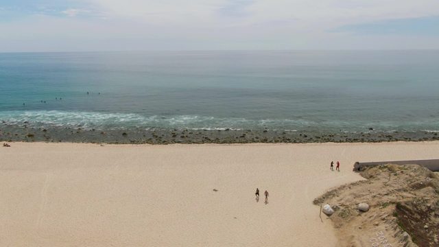 PUNTA GORDA BEACH BCS MEXICO-2023: People Walking on Sandy Beach near Ocean
