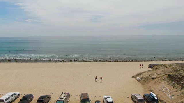 PUNTA GORDA BEACH BCS MEXICO-2023: Beach Parking Area with People Walking and Cars Arriving