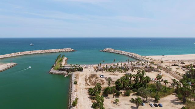 PUERTO LOS CABOS BEACH BCS MEXICO-2023: Coastal Channel with Boat and Road Traffic