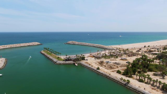 PUERTO LOS CABOS BEACH BCS MEXICO-2023: Boats Entering Coastal Harbor From Open Water