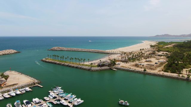 PUERTO LOS CABOS BEACH BCS MEXICO-2023: Marina Boats and Sandy Shore by Ocean