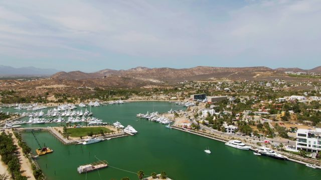 PUERTO LOS CABOS BEACH BCS MEXICO-2023: Marina with Yachts and a Passing Boat
