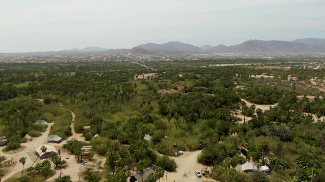 PUERTO LOS CABOS BEACH BCS MEXICO-2023: Rural Village with Huts and Dense Greenery From Above