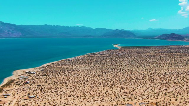 BAHIA DE LOS ANGELES BCS MEXICO-2022: Desert Shore with Shifting Tents and Vehicles