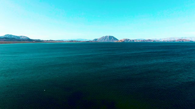 BAHIA DE LOS ANGELES BCS MEXICO-2022: Small Boat Gliding Across Tranquil Blue Water