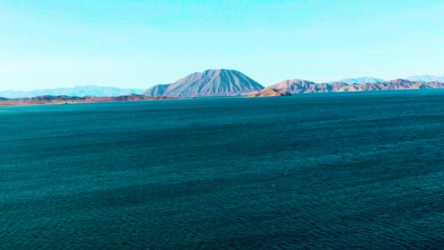 BAHIA DE LOS ANGELES BCS MEXICO-2022: Calm Ocean Waters and Distant Mountain Coastline