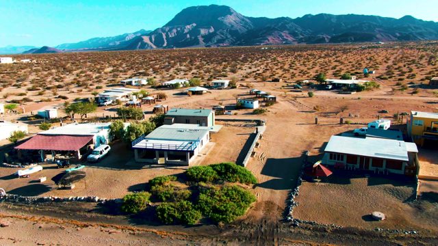 BAHIA DE LOS ANGELES BCS MEXICO-2022: Drone Flight over Desert Settlement with Moving Vehicles