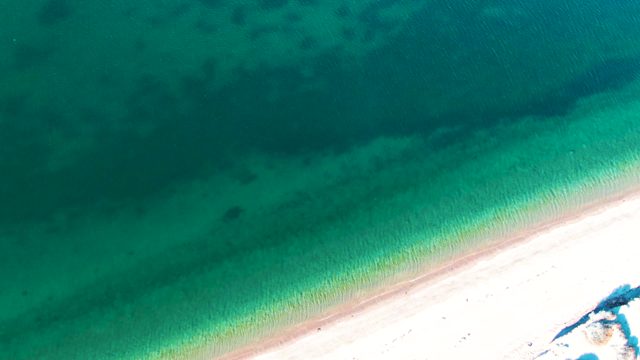 BAHIA DE LOS ANGELES BCS MEXICO-2022: Gentle Waves Receding on Sandy Beach