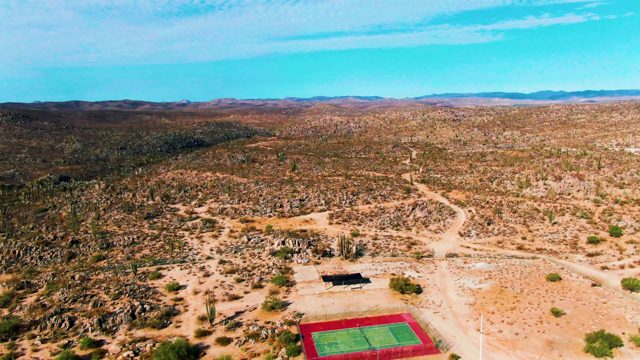 CATAVINA BC MEXICO-2022: Tennis Court in Desert Landscape Receding From View